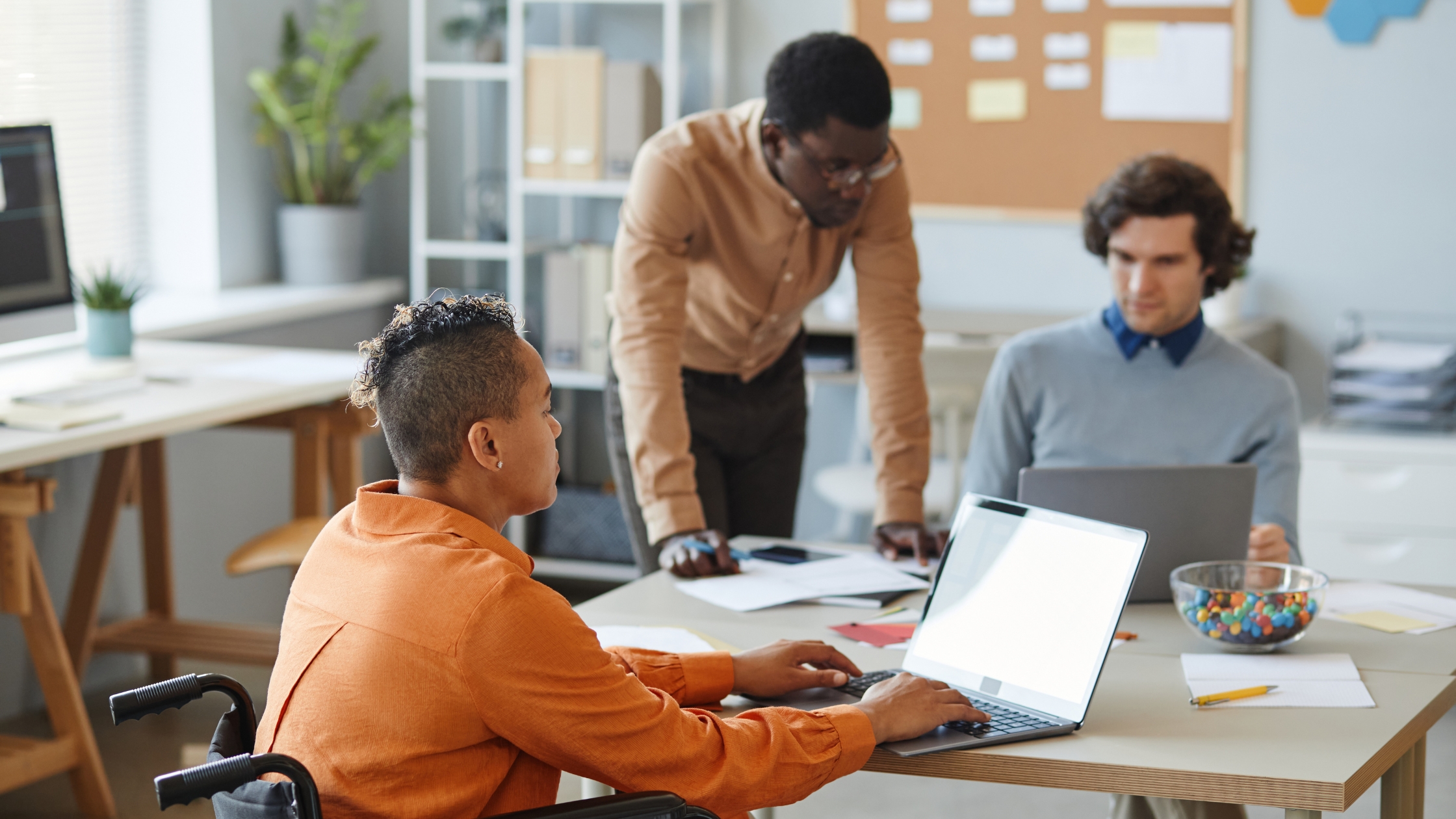 Person with disability in office thanks to IT support for NDIS providers