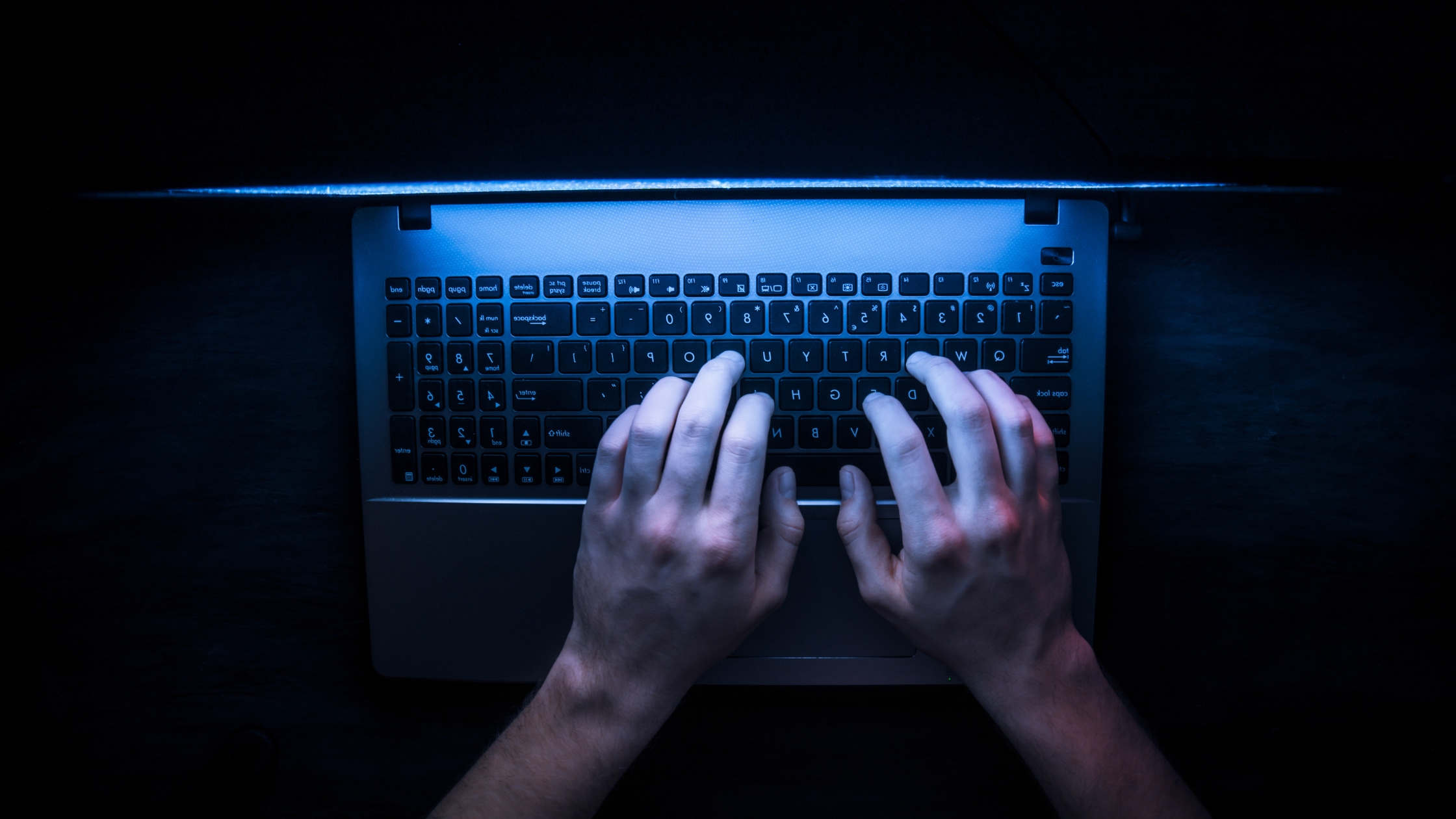 Hacker hacking the server in the dark web, posing cyber threats to the business