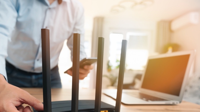 Man using modern wireless router for Business nbn for Halls Gap